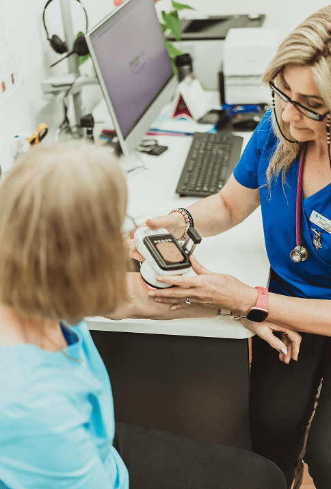 Healthcare professional performing a skin check