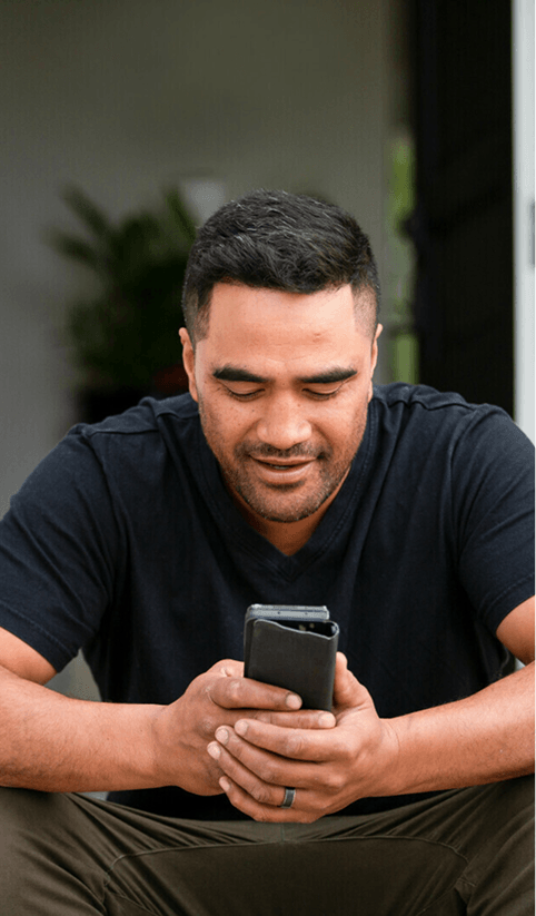 Man using phone for telehealth consultation