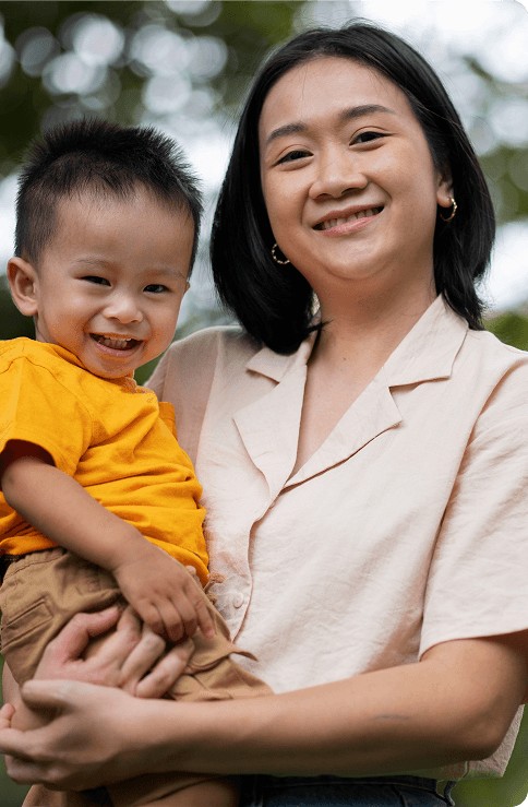 Mother holding child outdoors