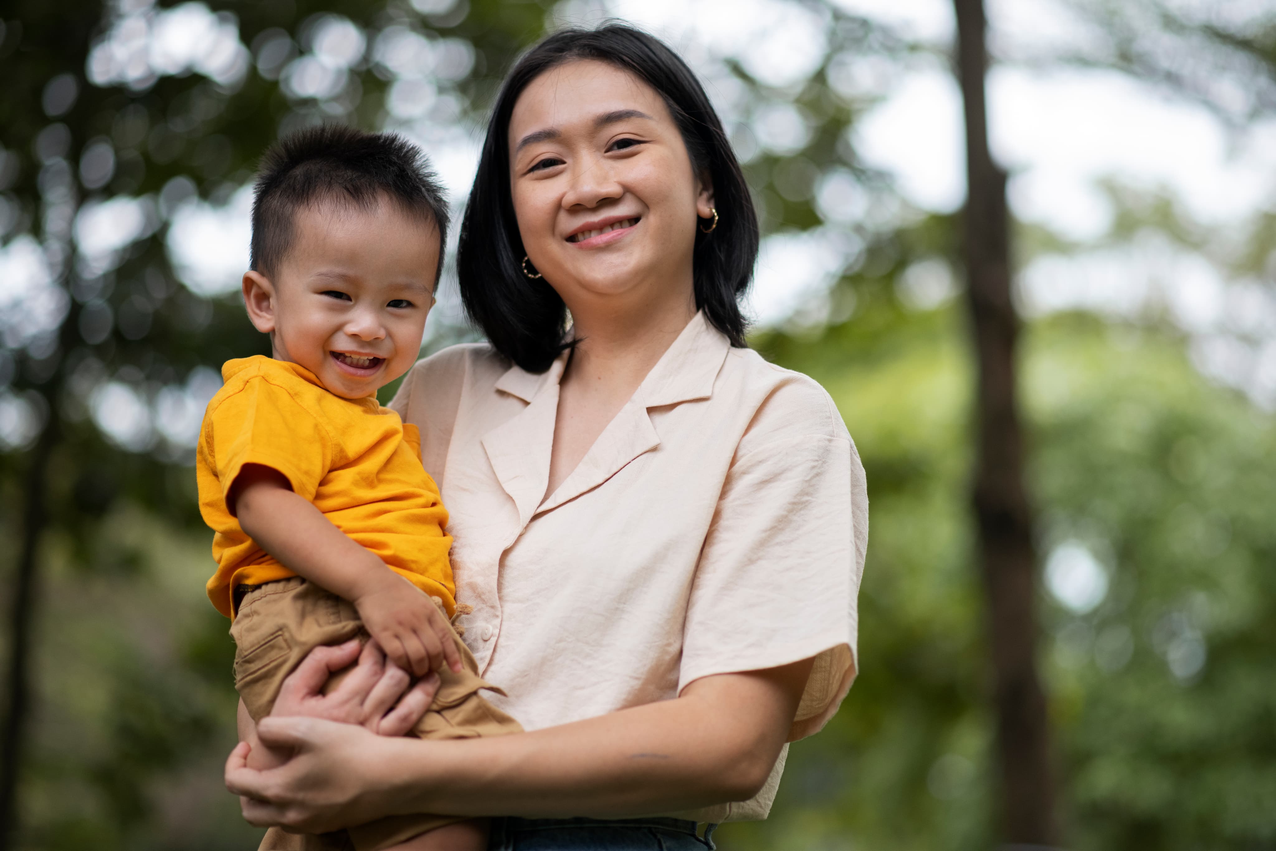 Mother holding child outdoors